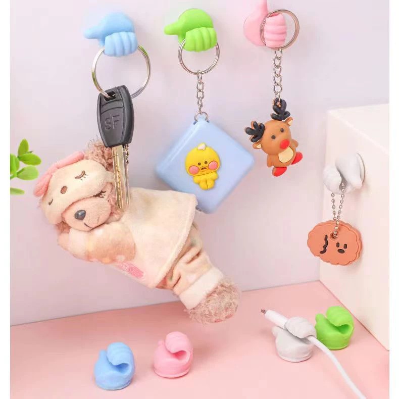 Unique hand shaped headphone cable hanger