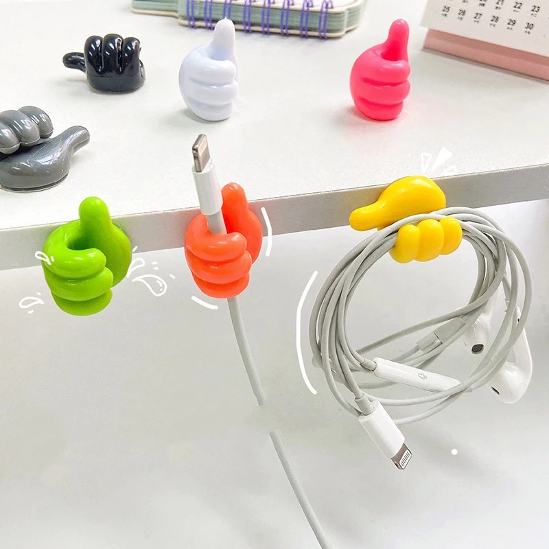 Unique hand shaped headphone cable hanger